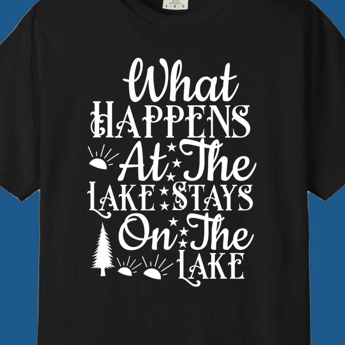 What Happens At The Lake text design with sun, stars, and pine tree.