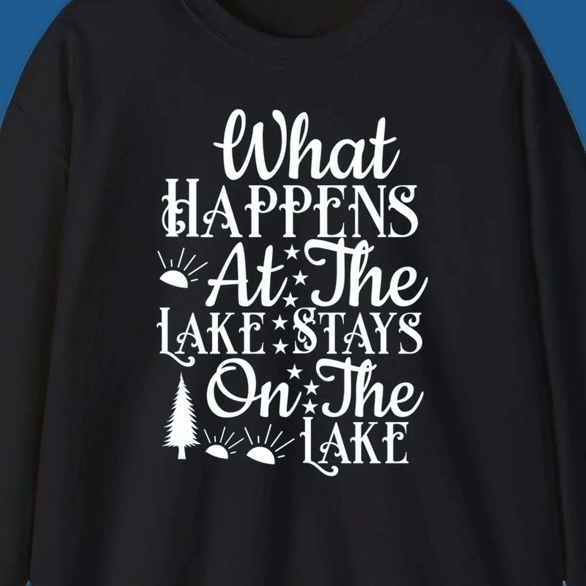 What Happens At The Lake text design with sun, stars, and pine tree.