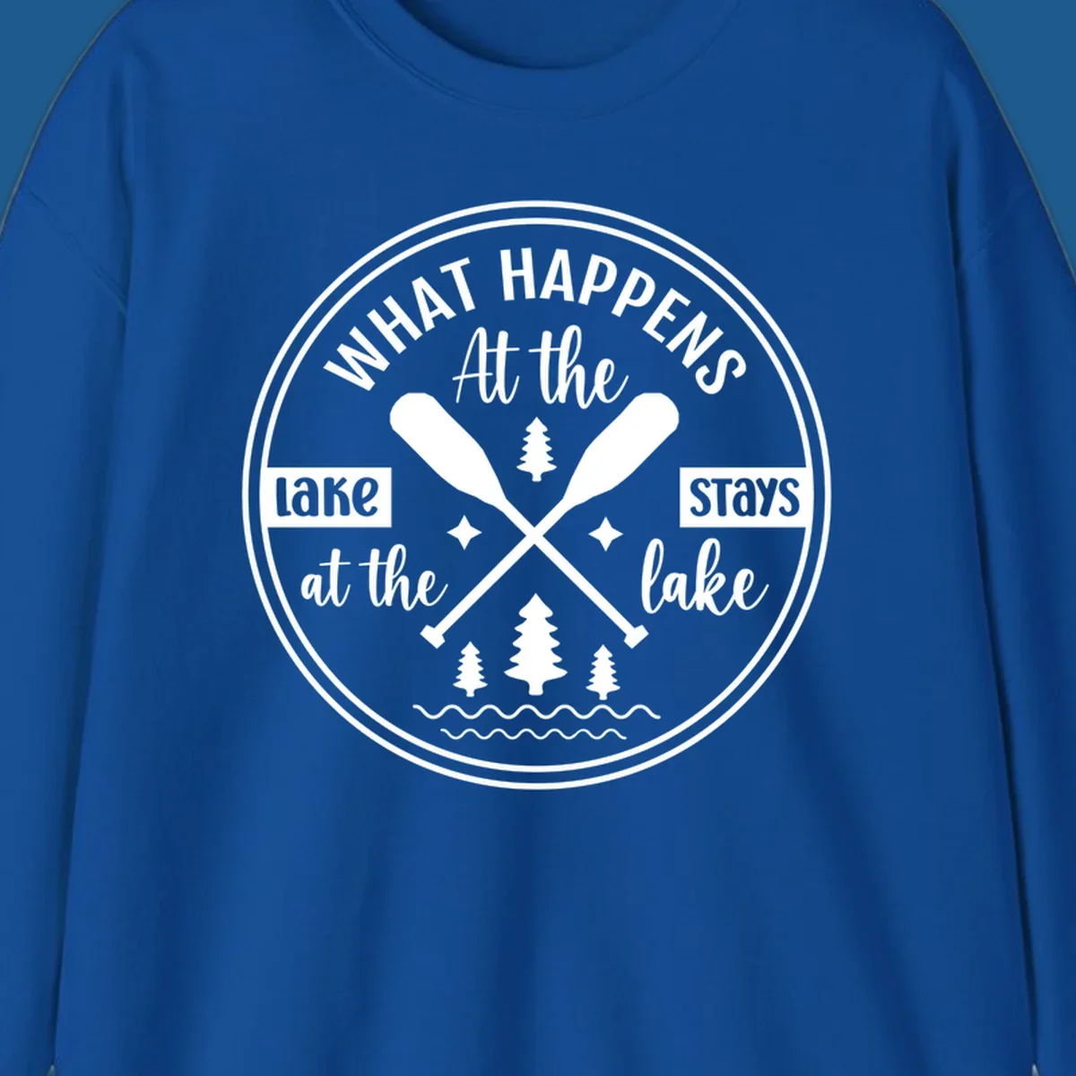 Lake life quote design with paddles and trees.