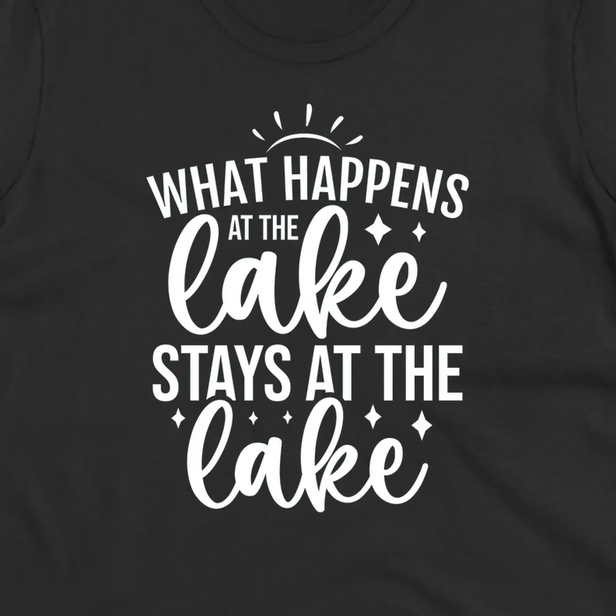 What happens at the lake stays at the lake typography design with sun rays and sparkles.