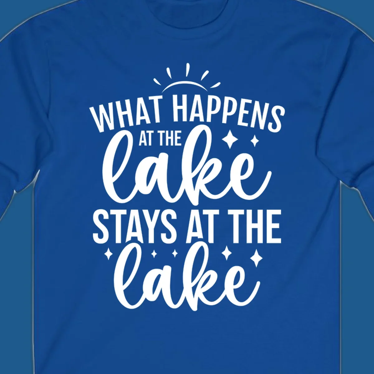 What happens at the lake stays at the lake typography design with sun rays and sparkles.
