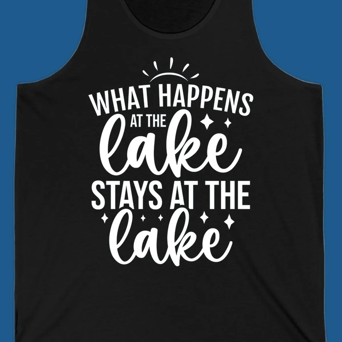 What happens at the lake stays at the lake typography design with sun rays and sparkles.