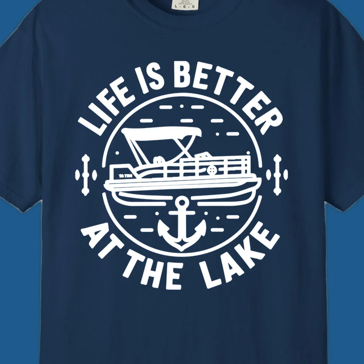 Circular design with "Life is Better At The Lake" text, pontoon boat, and anchor.