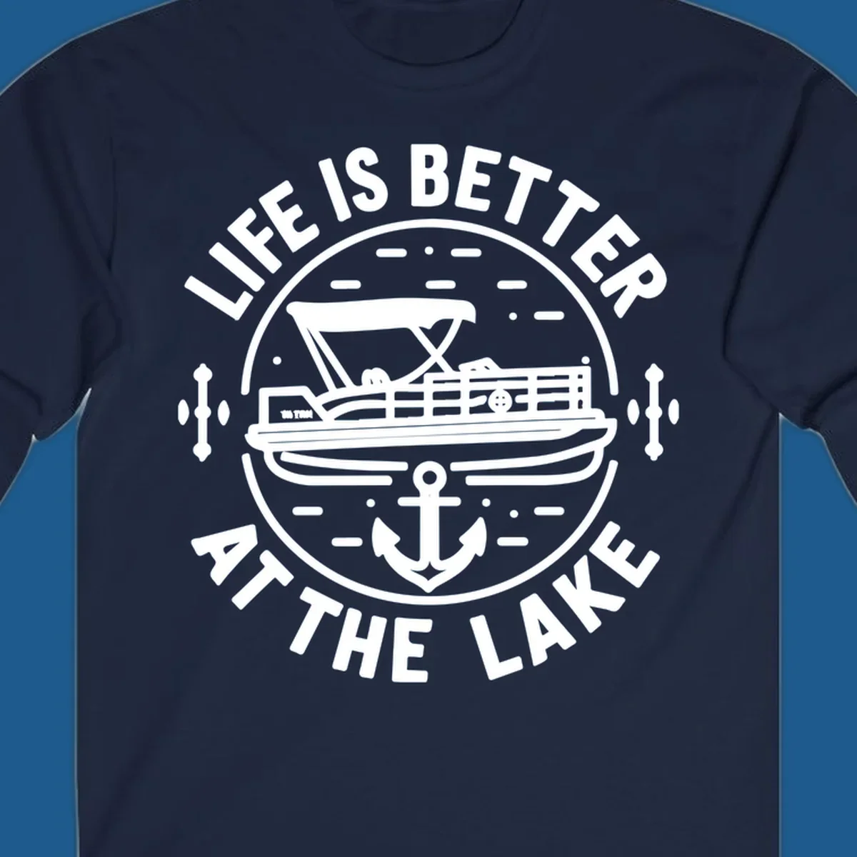 Circular design with "Life is Better At The Lake" text, pontoon boat, and anchor.