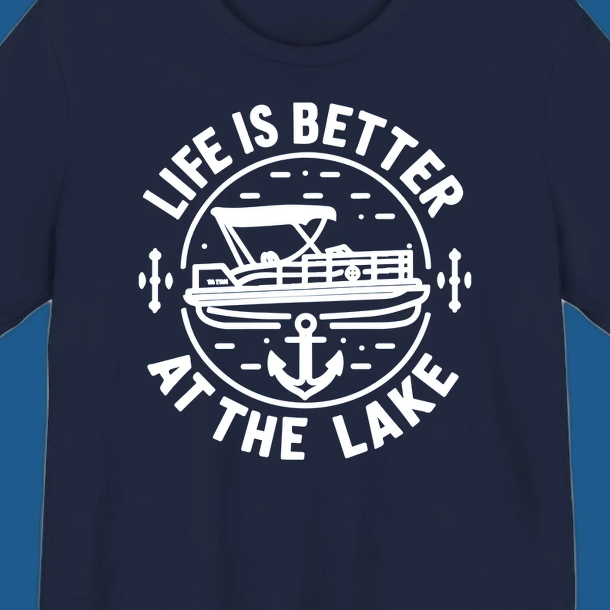 Circular design with "Life is Better At The Lake" text, pontoon boat, and anchor.