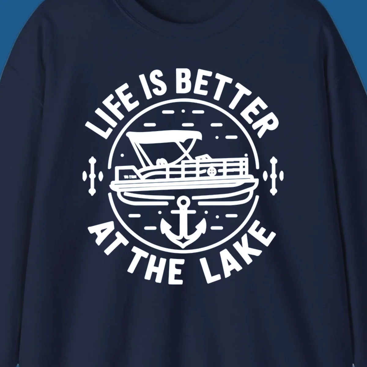 Circular design with "Life is Better At The Lake" text, pontoon boat, and anchor.