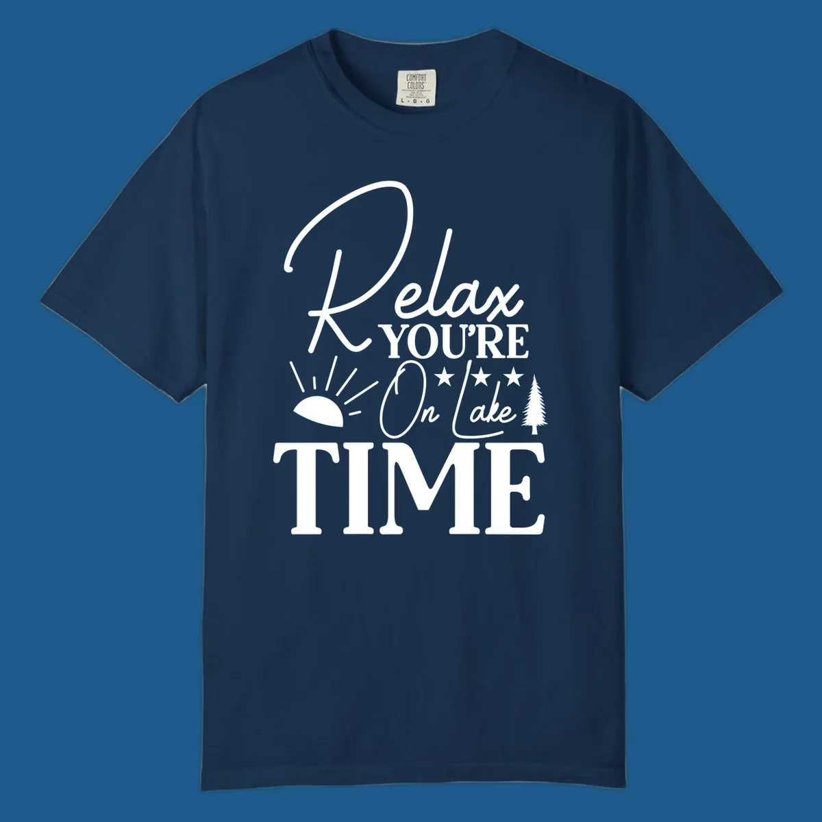 Relax You're On Lake Time text and graphics with sun rays and a pine tree.