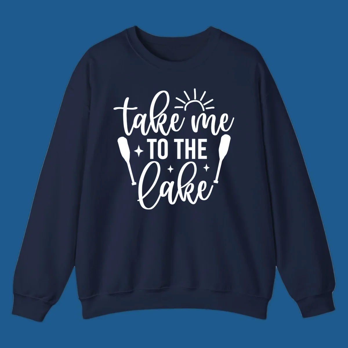 Typography design with 'take me TO THE Lake', sun, paddles, and stars for lake life vibes.