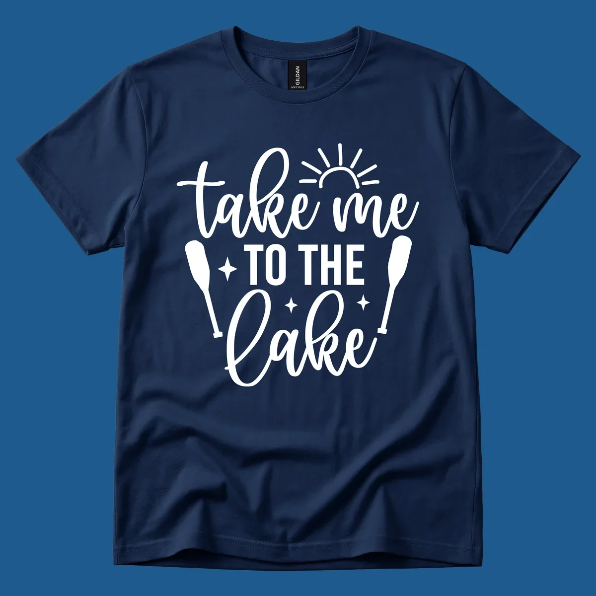 Typography design with 'take me TO THE Lake', sun, paddles, and stars for lake life vibes.