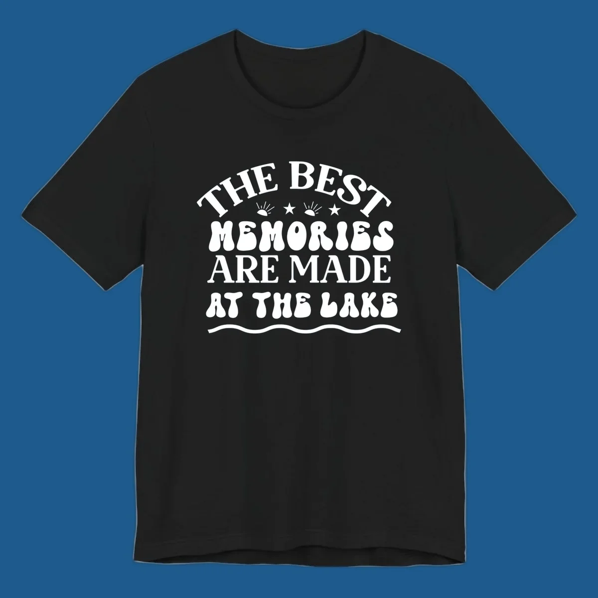 Retro typography design 'The Best Memories Are Made At The Lake' with sun rays and stars.
