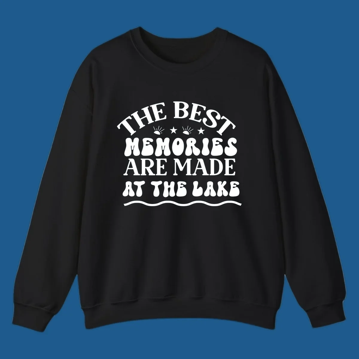 Retro typography design 'The Best Memories Are Made At The Lake' with sun rays and stars.