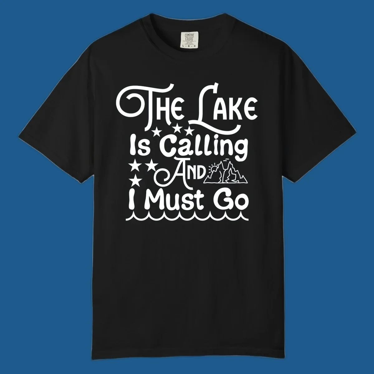 The Lake Is Calling And I Must Go text with mountains and water waves.