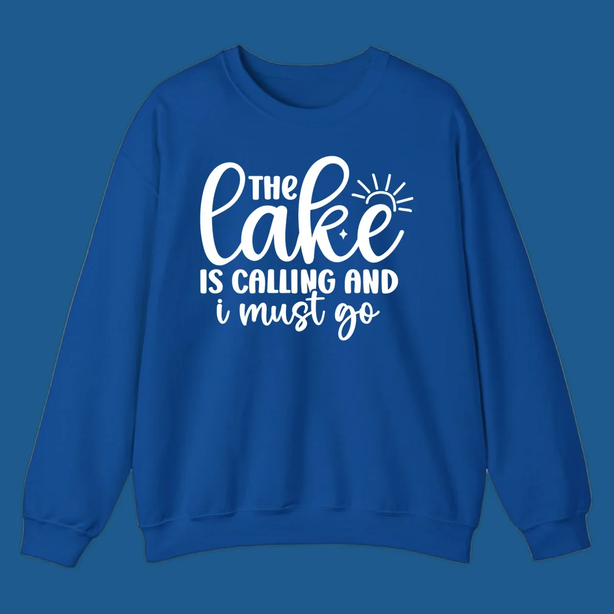 The lake is calling and I must go text with sun and star graphic