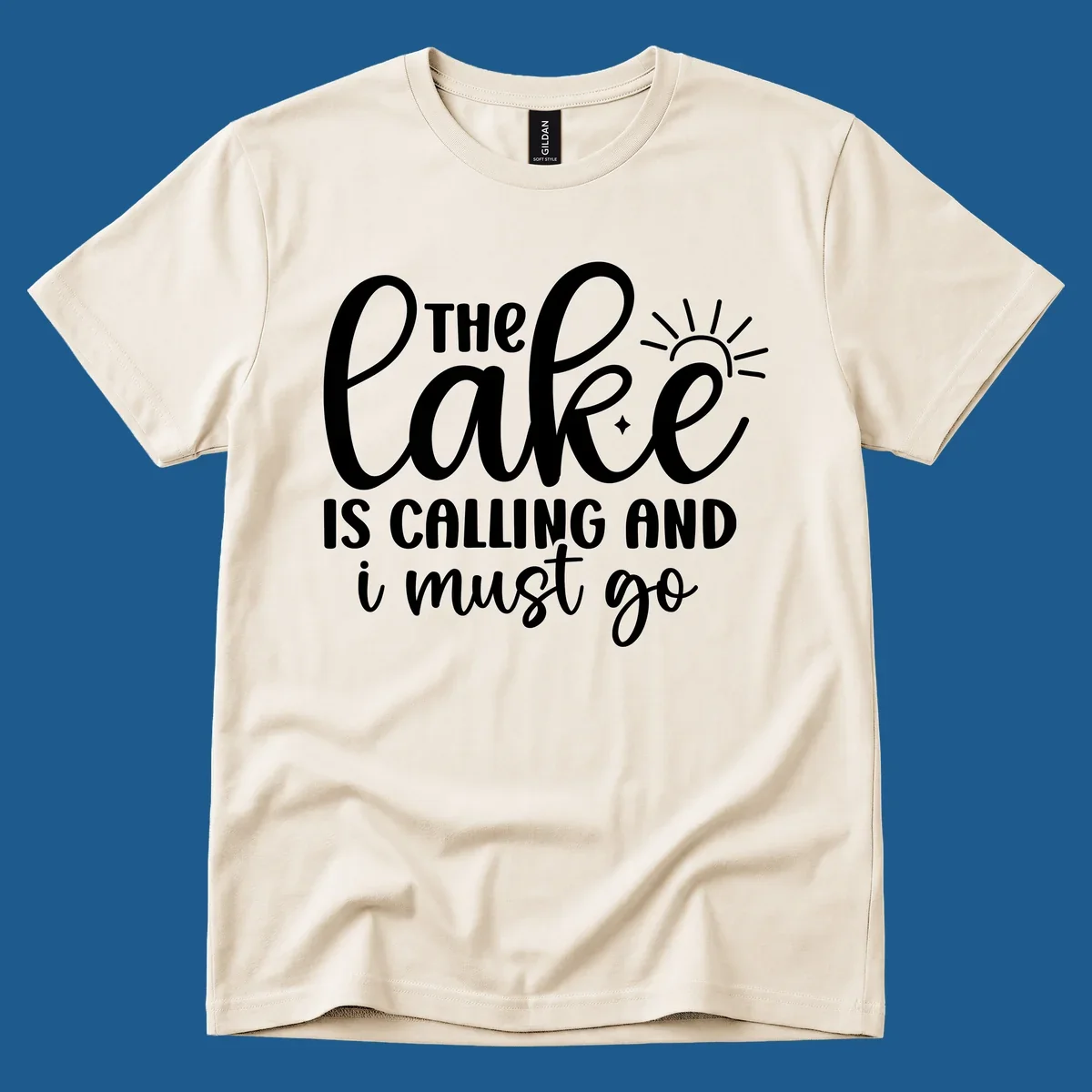The lake is calling and I must go text with sun and star graphic