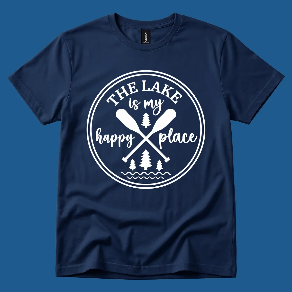 Circular graphic with text 'The Lake is my happy place', crossed oars, and pine trees - lake-happy-place.