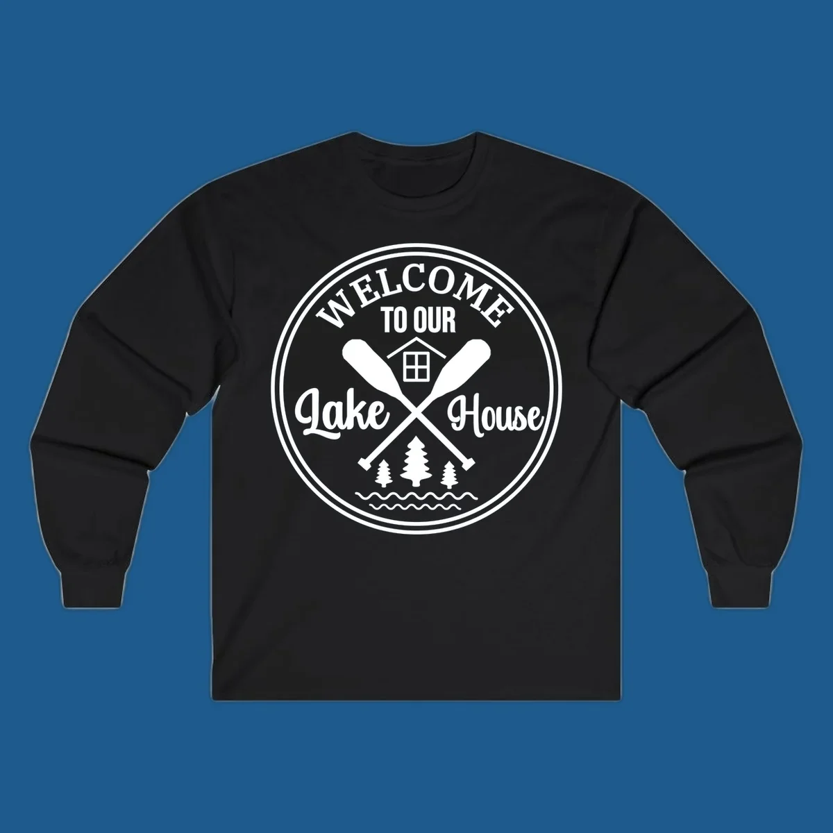 Circular badge design with text 'WELCOME TO OUR Lake House', crossed oars, house, trees, and waves.