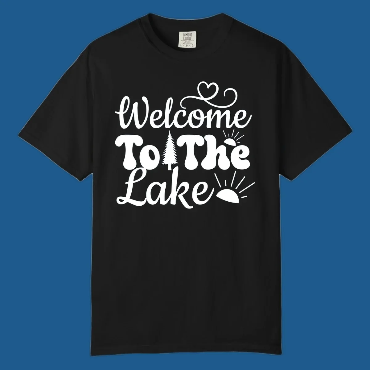 Welcome to the lake typography design with tree and sun graphics.