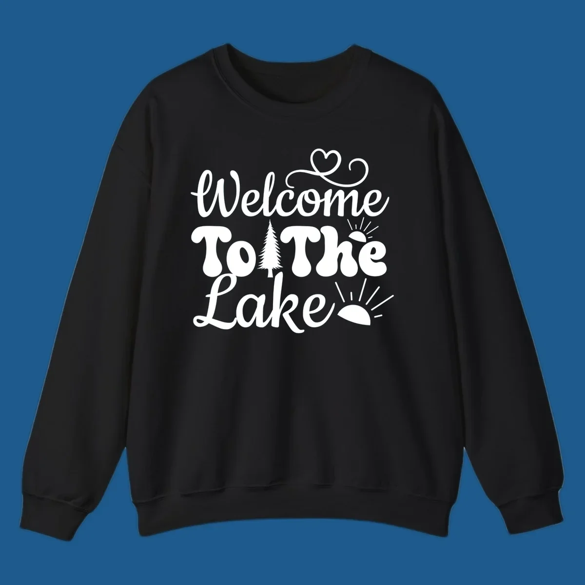 Welcome to the lake typography design with tree and sun graphics.