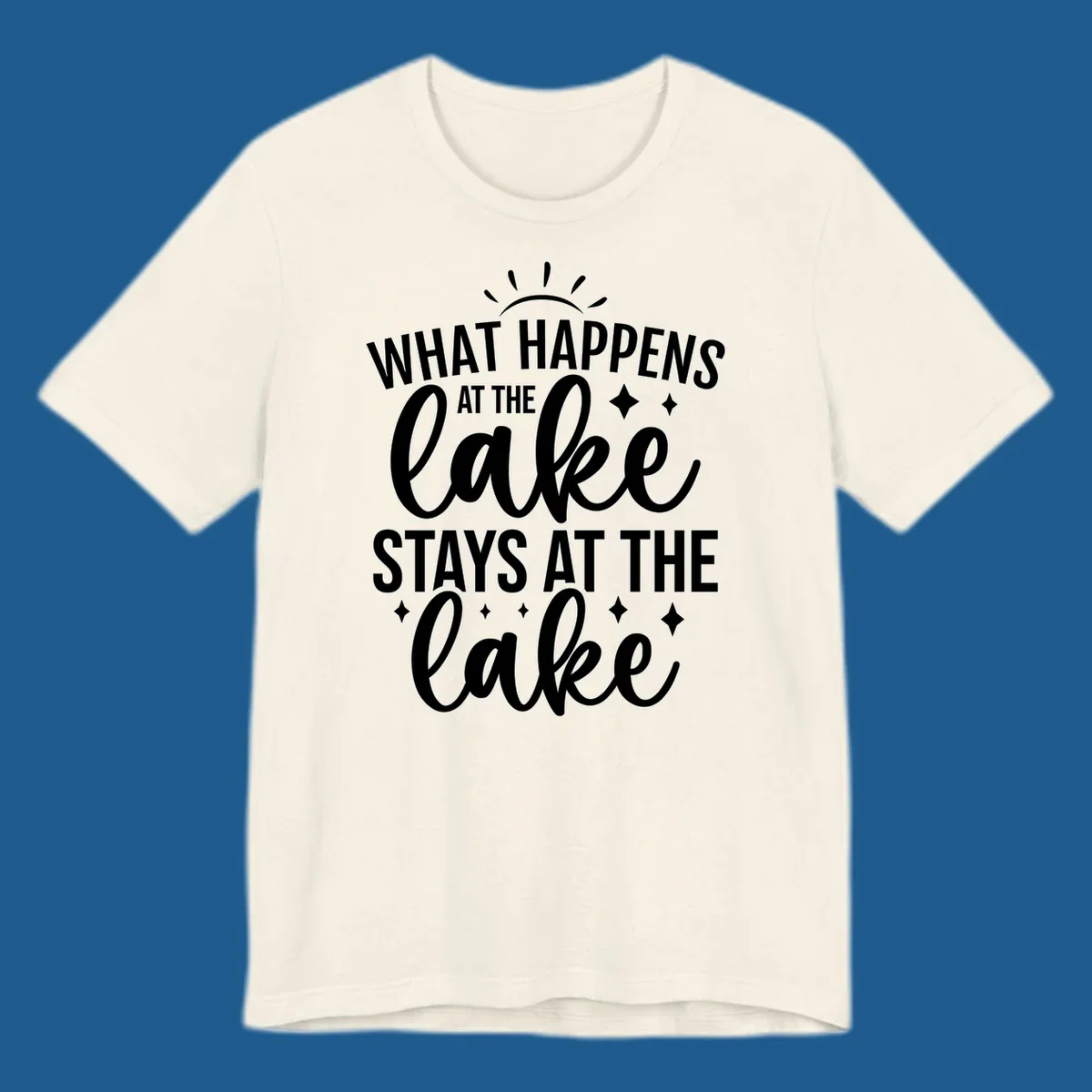 What happens at the lake stays at the lake typography design with sun rays and sparkles.