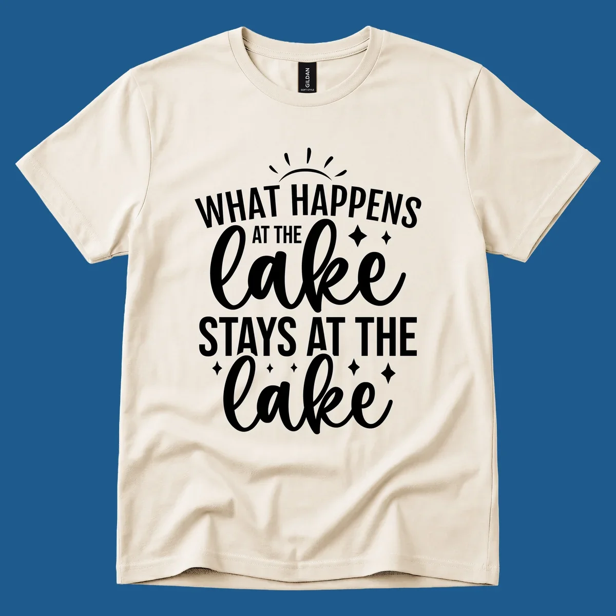 What happens at the lake stays at the lake typography design with sun rays and sparkles.