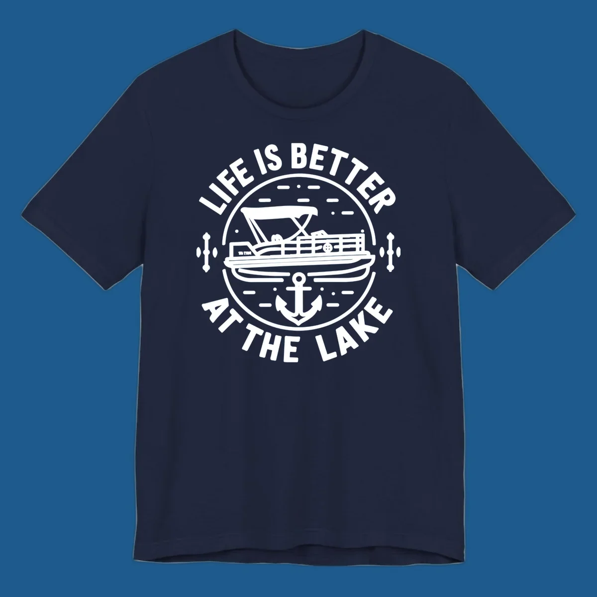 Circular design with "Life is Better At The Lake" text, pontoon boat, and anchor.