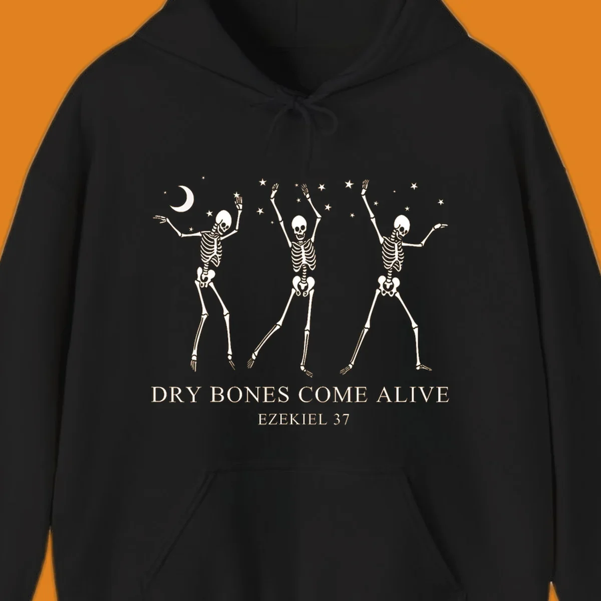 Three dancing skeletons under a moon and stars, with text 'Dry Bones Come Alive Ezekiel 37'.