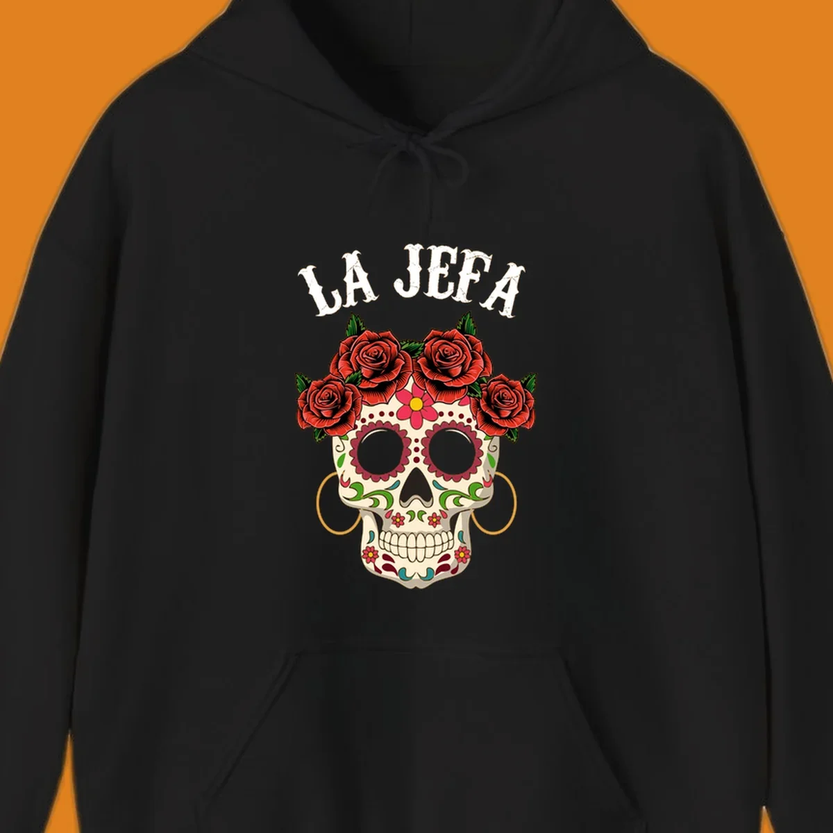 A colorful La Jefa sugar skull design with a crown of red roses and gold hoop earrings.