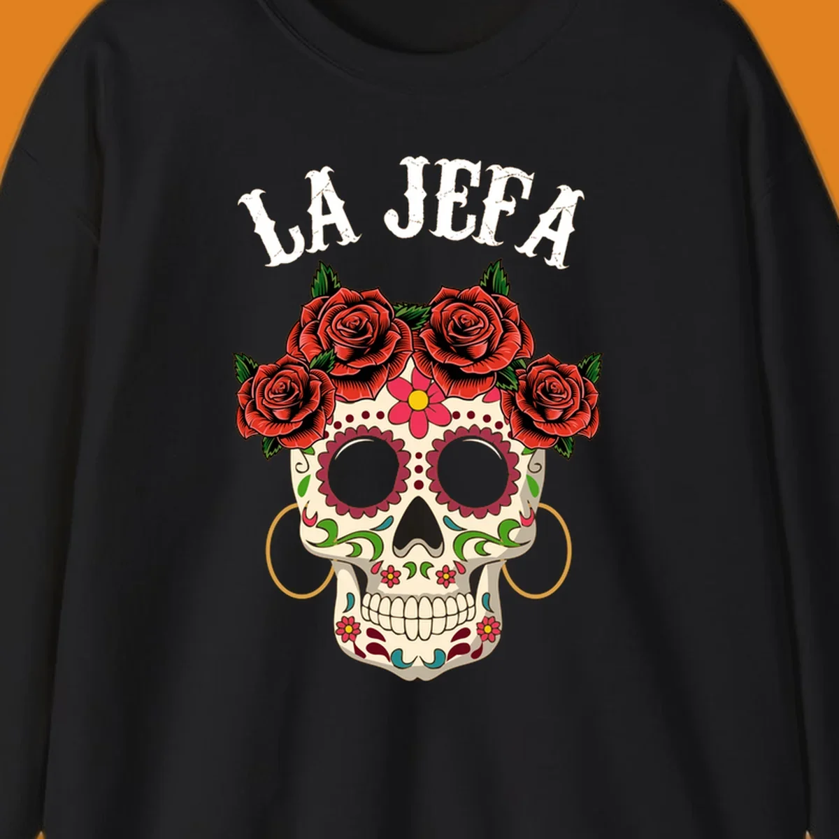 A colorful La Jefa sugar skull design with a crown of red roses and gold hoop earrings.