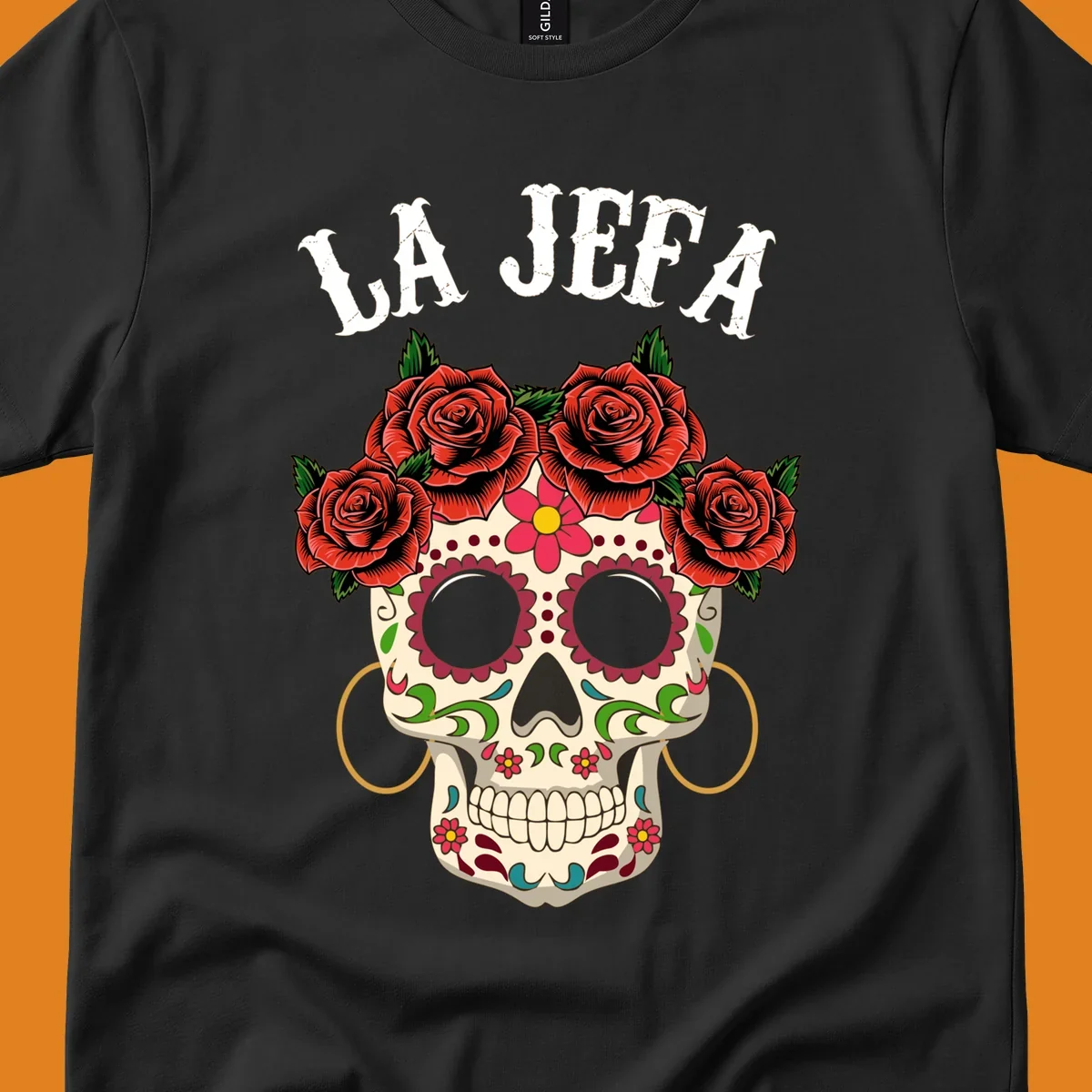 A colorful La Jefa sugar skull design with a crown of red roses and gold hoop earrings.