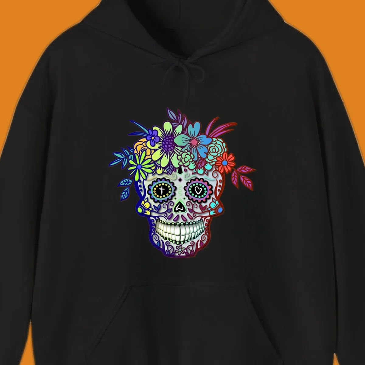 A vibrant floral calavera skull, decorated with intricate patterns and wearing a multicolored crown of flowers and leaves.
