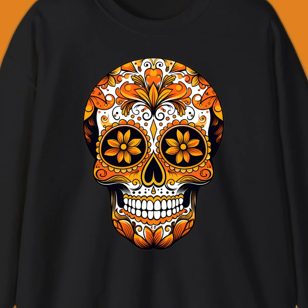 A vibrant marigold calavera skull illustration with intricate orange and yellow floral patterns on a black and white background.