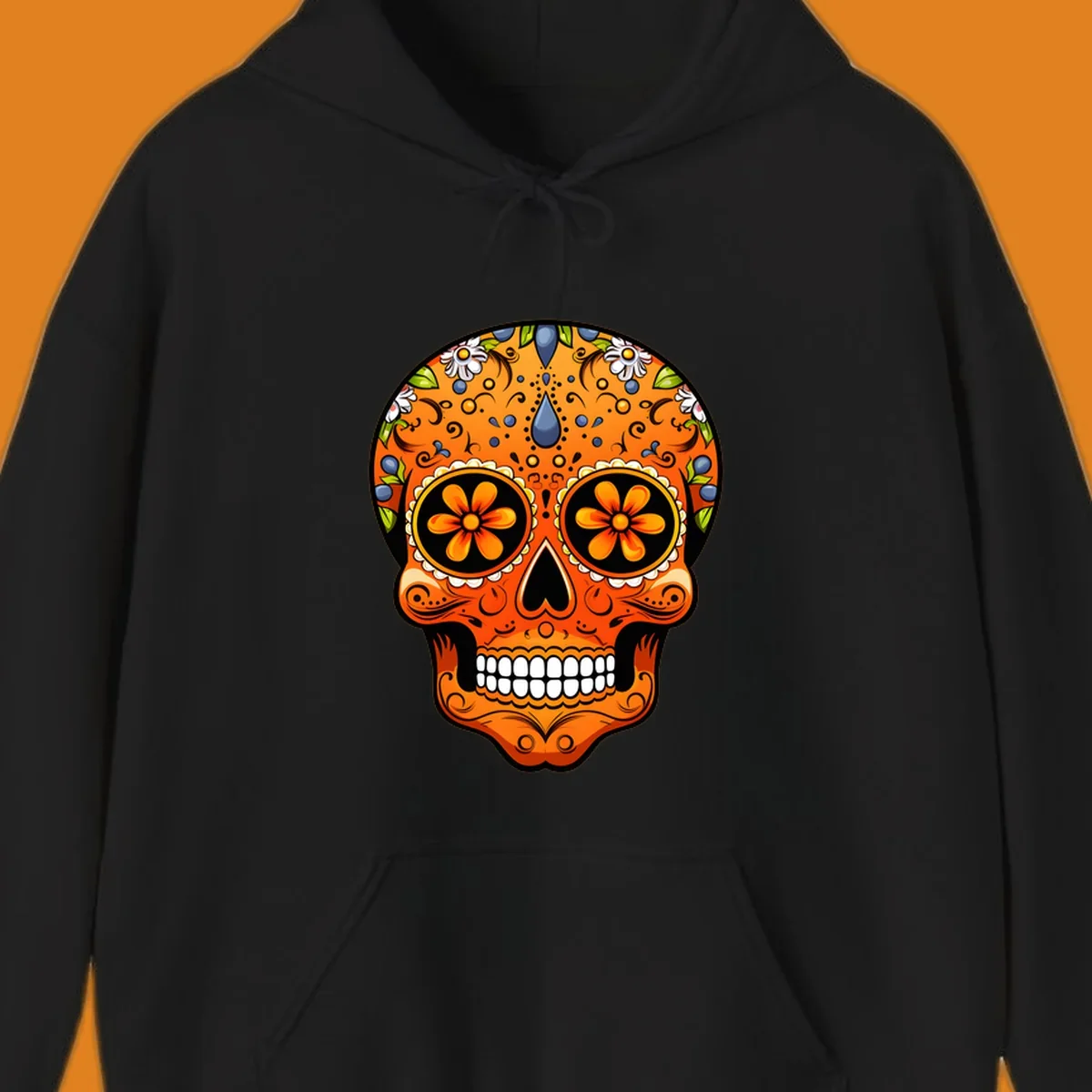 A vibrant orange calavera sugar skull with blue and white flowers, green leaves, and intricate swirling patterns.