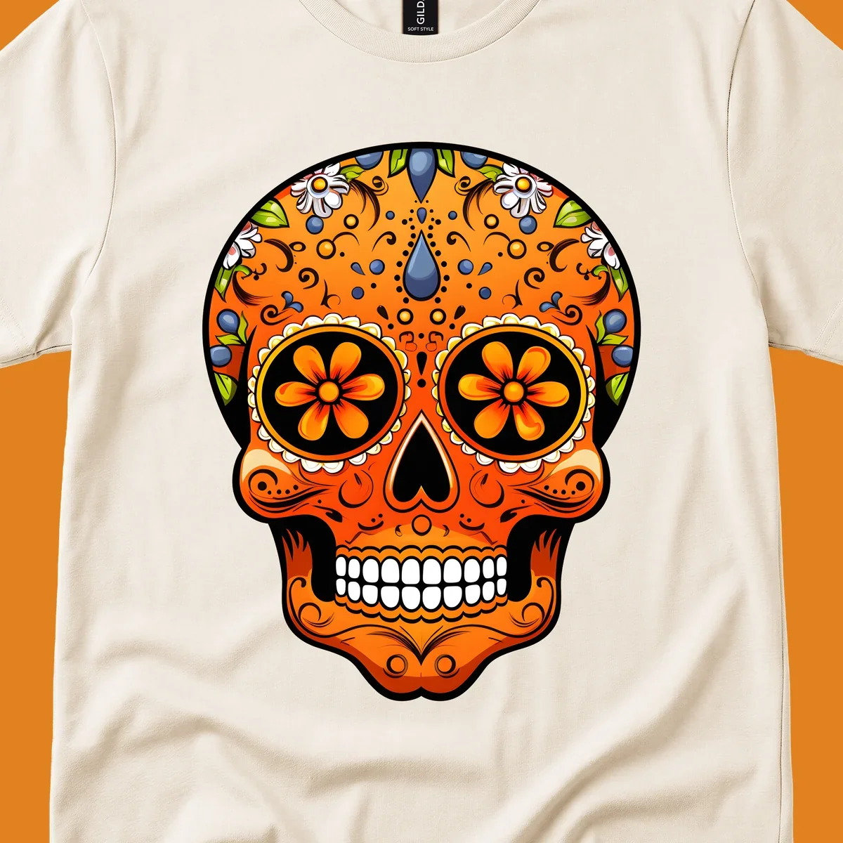 A vibrant orange calavera sugar skull with blue and white flowers, green leaves, and intricate swirling patterns.