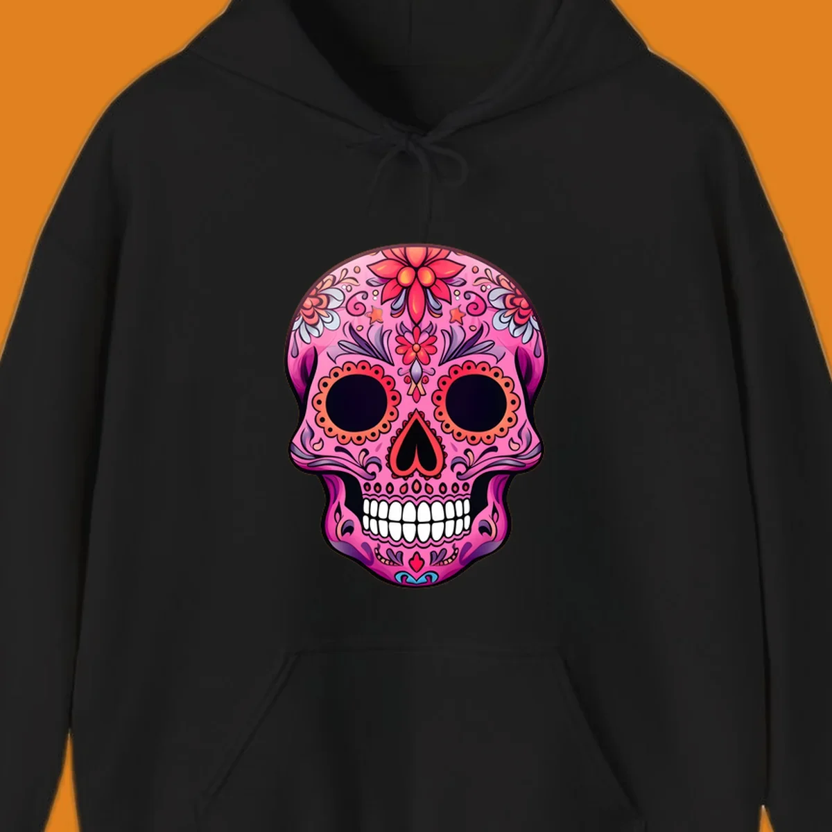 A vibrant pink calavera sugar skull design, adorned with intricate floral patterns, swirls, and stars. Features dark eye sockets, heart nose, and white teeth.