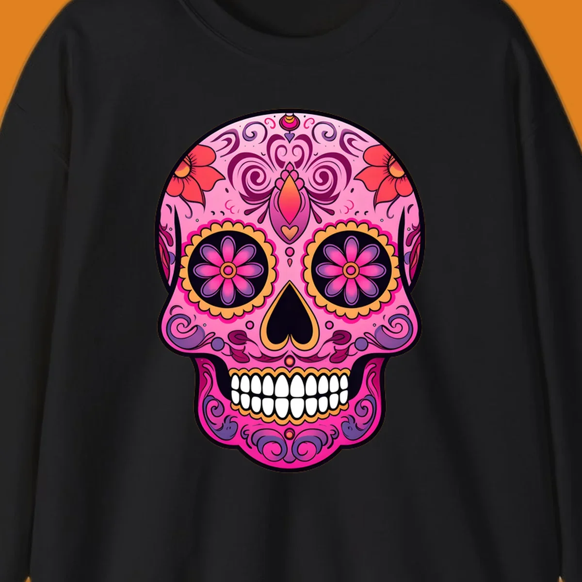 A vibrant pink and purple sugar skull, decorated with intricate floral patterns, swirls, and bright yellow and orange accents, featuring white teeth.