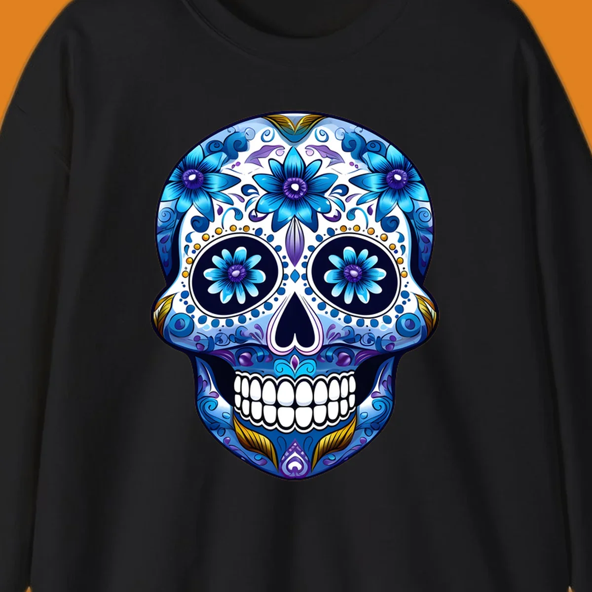A vibrant blue floral calavera sugar skull illustration with intricate patterns, white teeth, and gold accents.