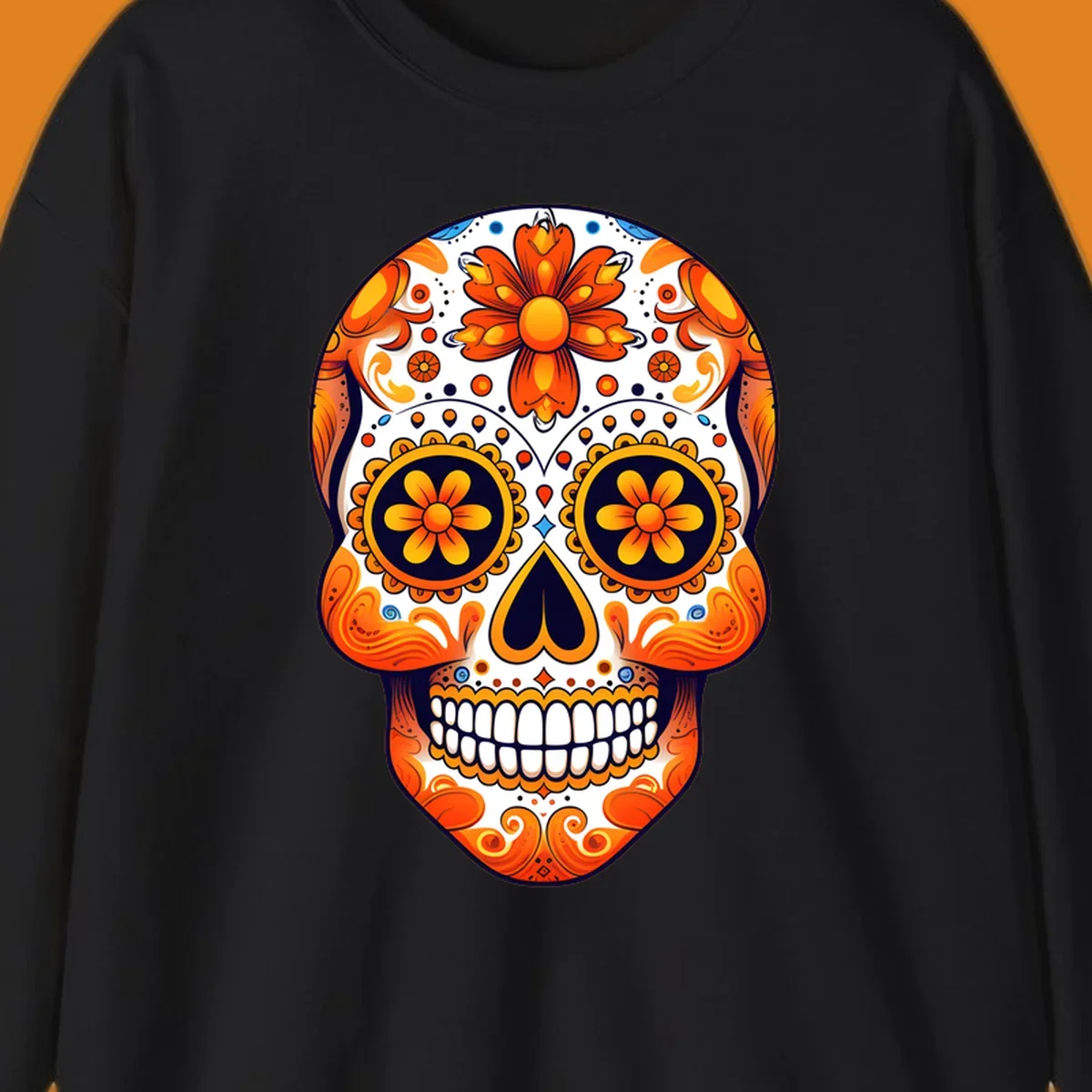 A vibrant marigold calavera skull illustration with orange flowers, white base, and navy accents.