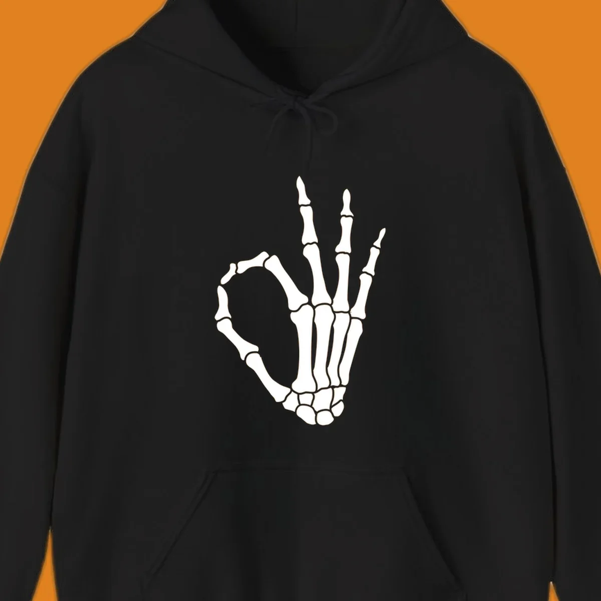 A white skeleton hand forms the 'okay' sign, with thumb and index finger creating a circle. A minimalist skeleton-hand-okay-sign.