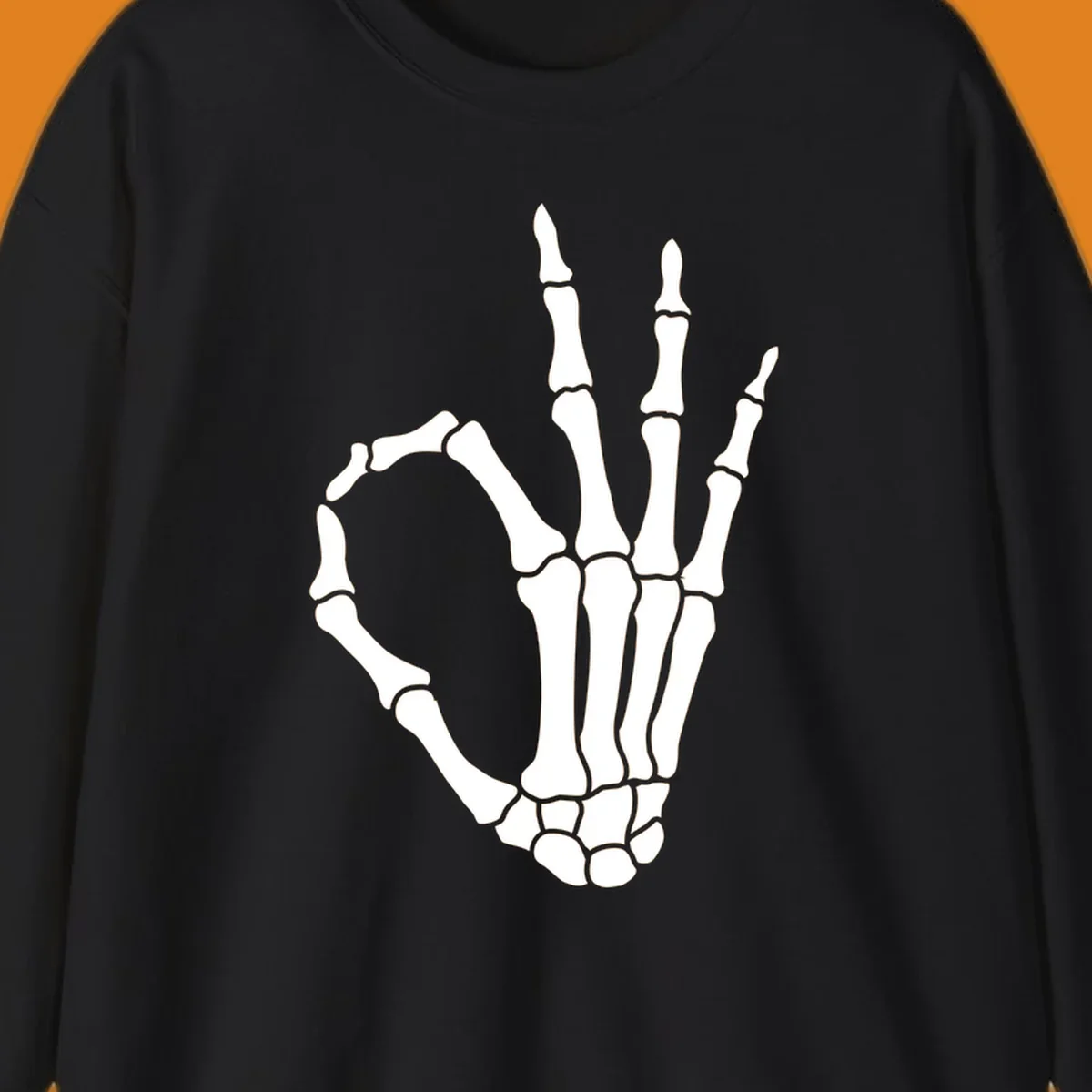 A white skeleton hand forms the 'okay' sign, with thumb and index finger creating a circle. A minimalist skeleton-hand-okay-sign.