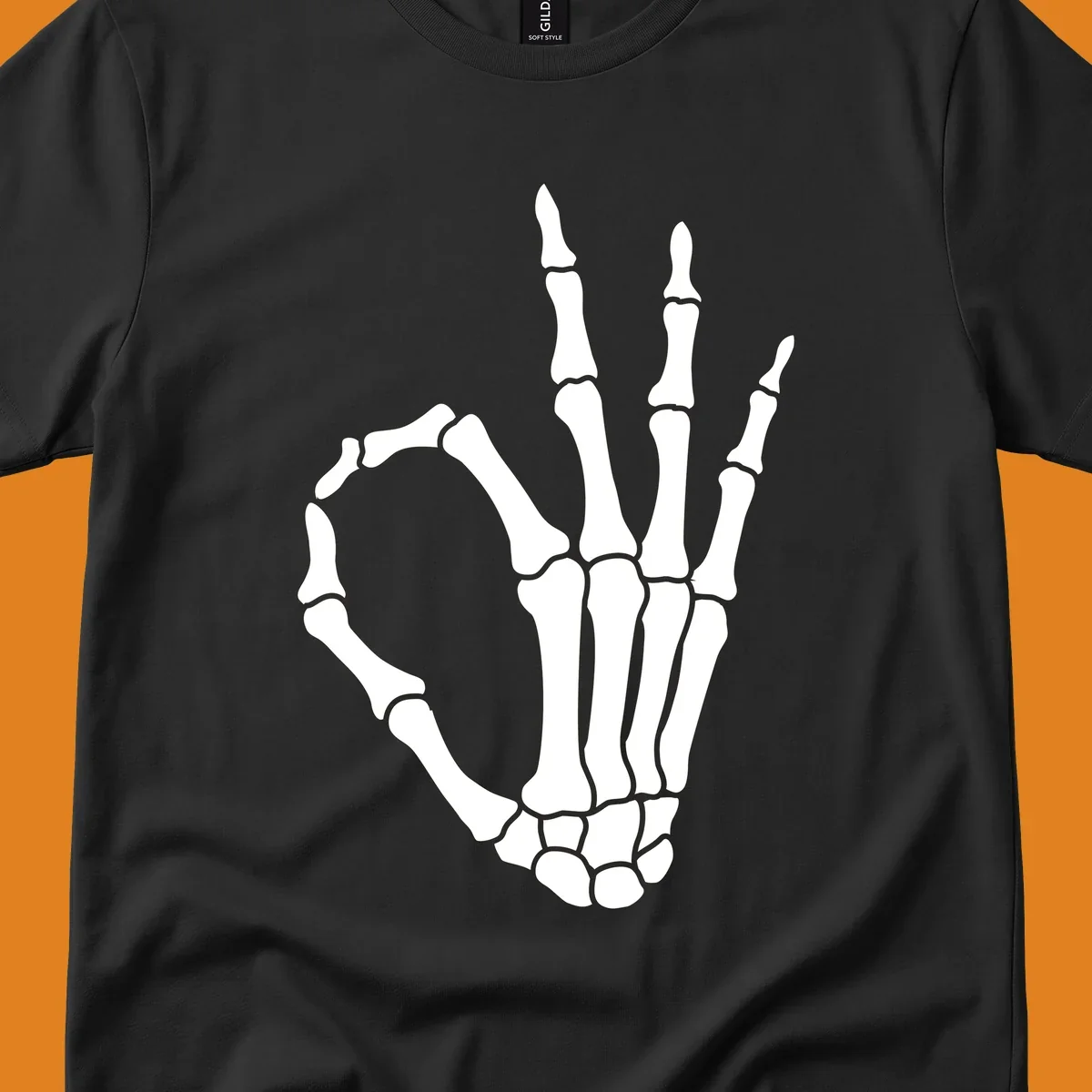 A white skeleton hand forms the 'okay' sign, with thumb and index finger creating a circle. A minimalist skeleton-hand-okay-sign.