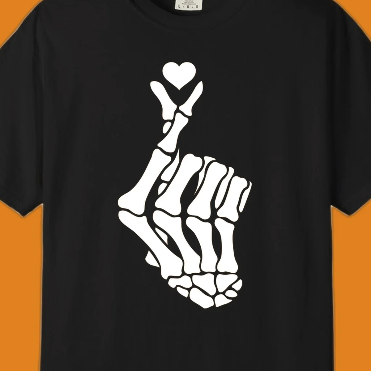 A white skeleton hand forms the Korean finger heart gesture, with a small heart shape at the fingertips. Concept: skeleton-finger-heart.