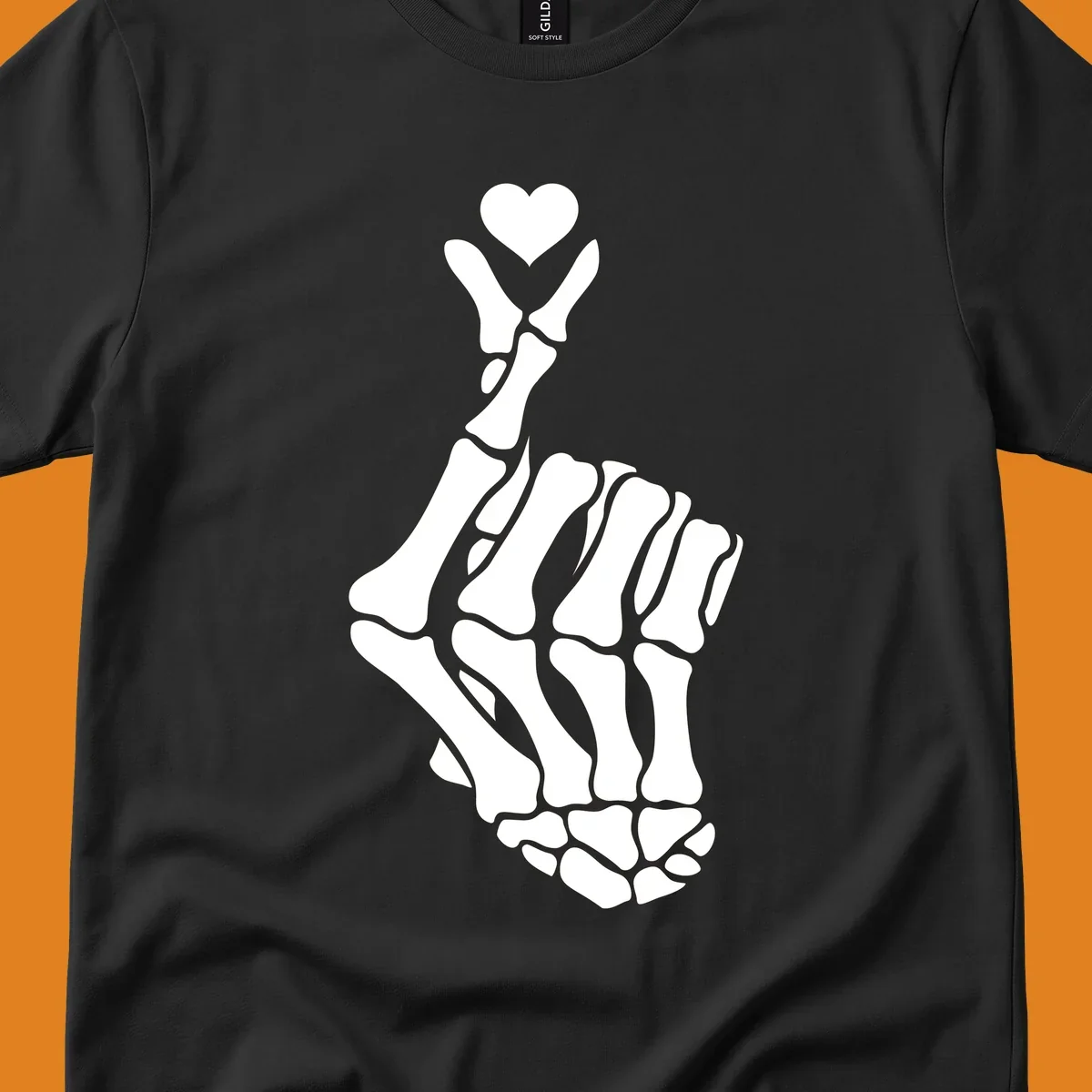 A white skeleton hand forms the Korean finger heart gesture, with a small heart shape at the fingertips. Concept: skeleton-finger-heart.