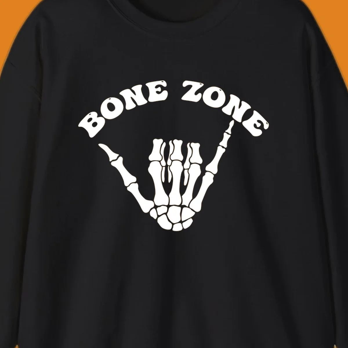 A white skeleton hand making a shaka sign with the arched text BONE ZONE above it, representing the bone-zone-shaka-skeleton concept.