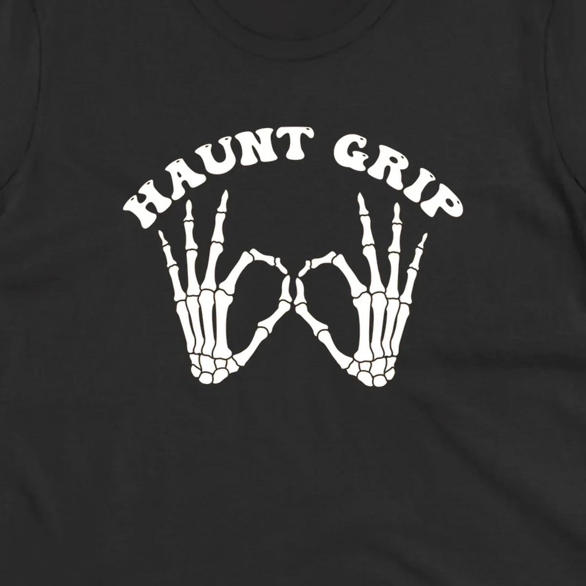 A graphic featuring two skeleton hands forming a heart shape, with 'HAUNT GRIP' text above, embodying the haunt-grip-skeleton-hands-heart theme.