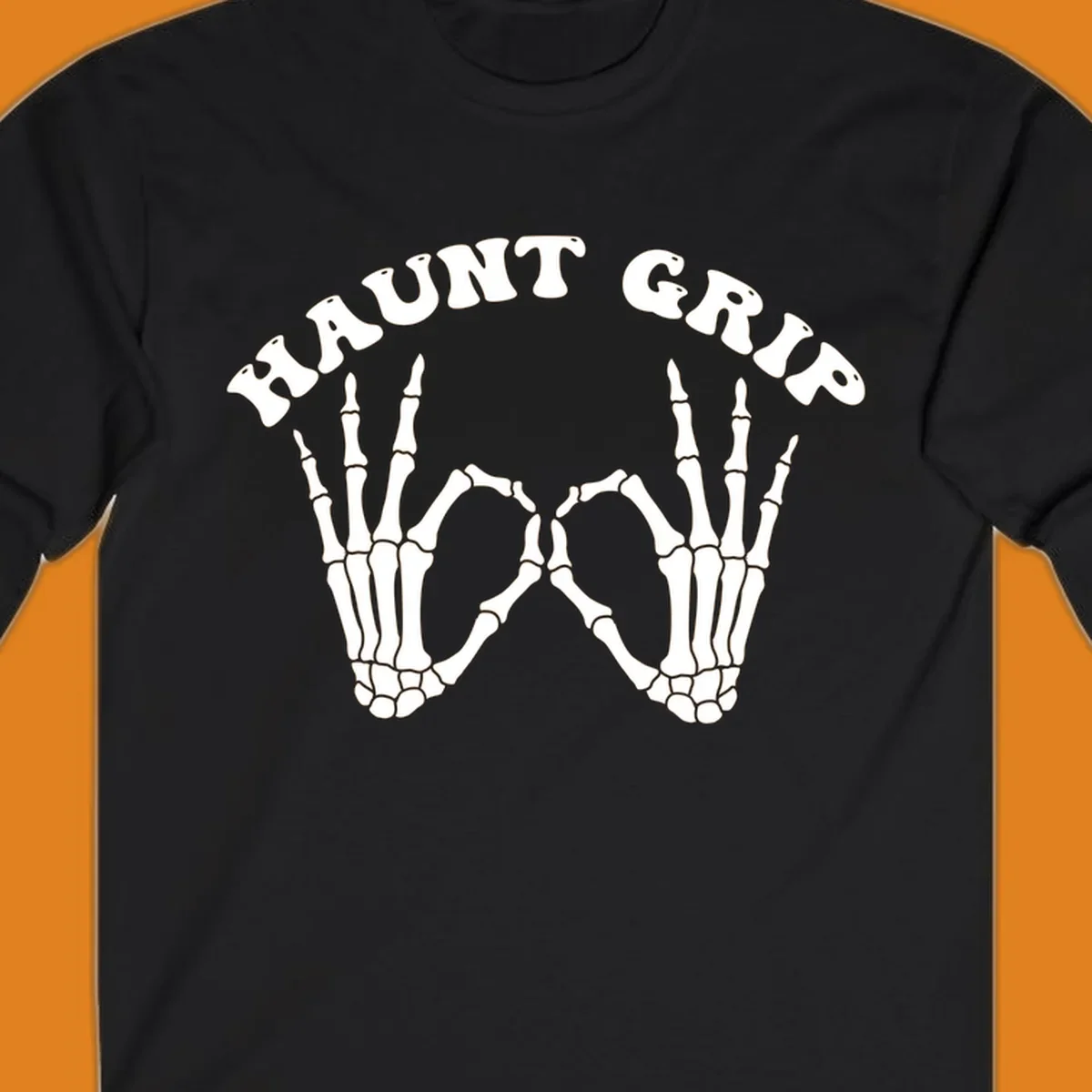 A graphic featuring two skeleton hands forming a heart shape, with 'HAUNT GRIP' text above, embodying the haunt-grip-skeleton-hands-heart theme.