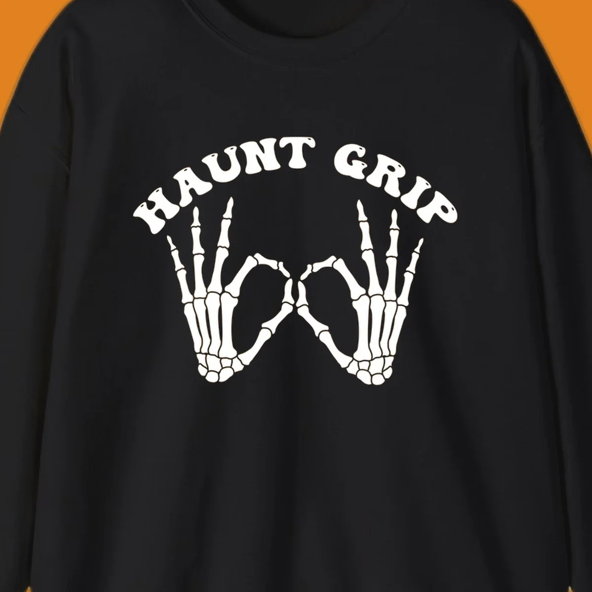 A graphic featuring two skeleton hands forming a heart shape, with 'HAUNT GRIP' text above, embodying the haunt-grip-skeleton-hands-heart theme.