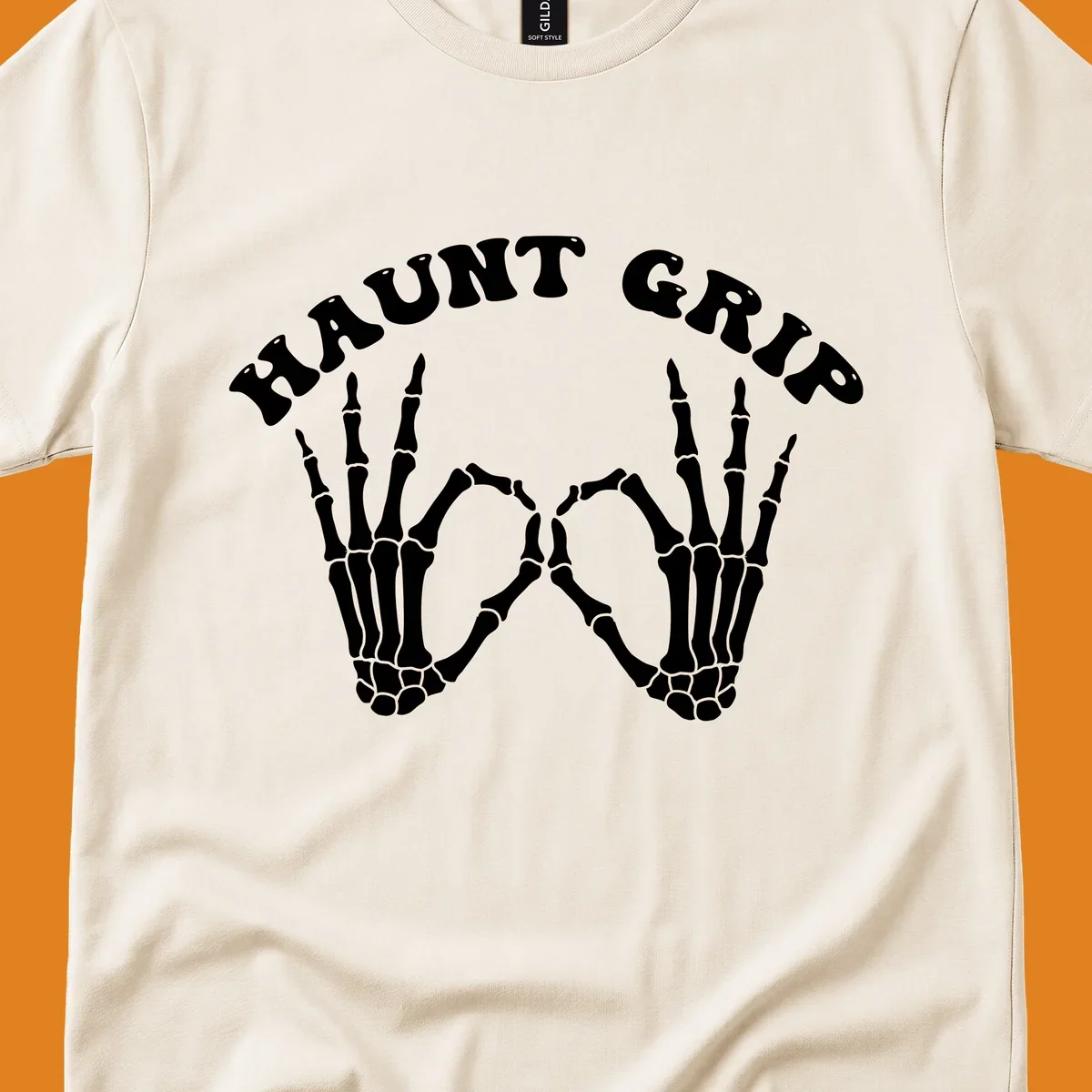 A graphic featuring two skeleton hands forming a heart shape, with 'HAUNT GRIP' text above, embodying the haunt-grip-skeleton-hands-heart theme.