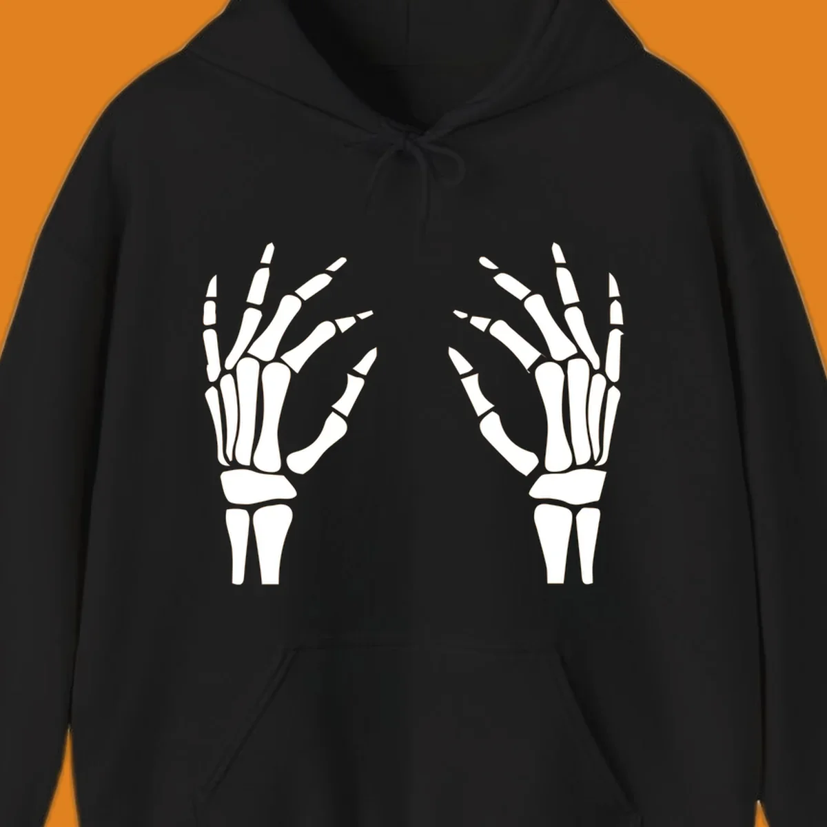 A pair of white skeletal hands reaching inwards on a dark background, illustrating the pair-skeletal-hands concept.