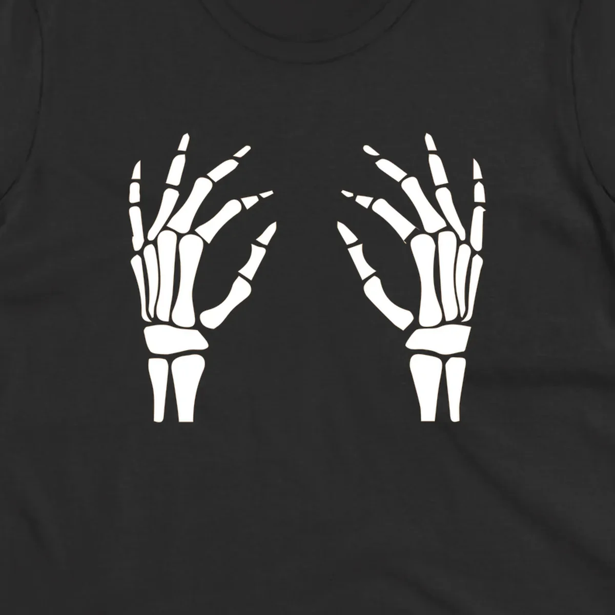 A pair of white skeletal hands reaching inwards on a dark background, illustrating the pair-skeletal-hands concept.