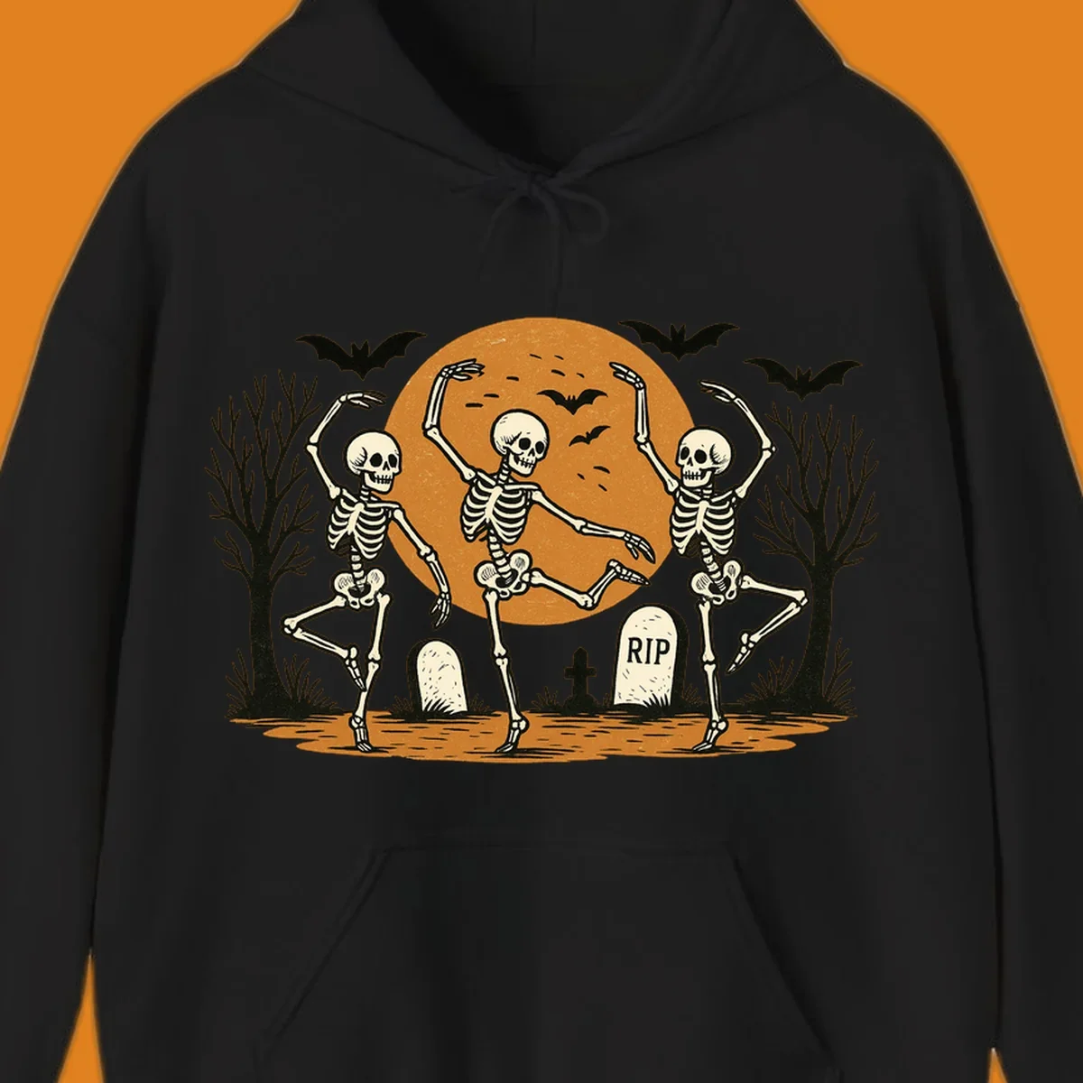 Dancing skeletons Halloween design with a full moon, bats, and gravestones.